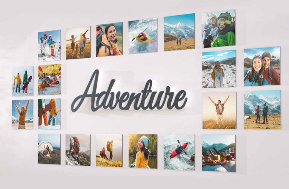Multiple Snapfish Photo Tiles featuring vacation photos are displayed around the word adventure on a wall 
