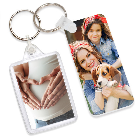 Two keyrings showing women with baby bump and mother and child