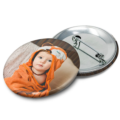 Pin badge with a photo of a young boy 